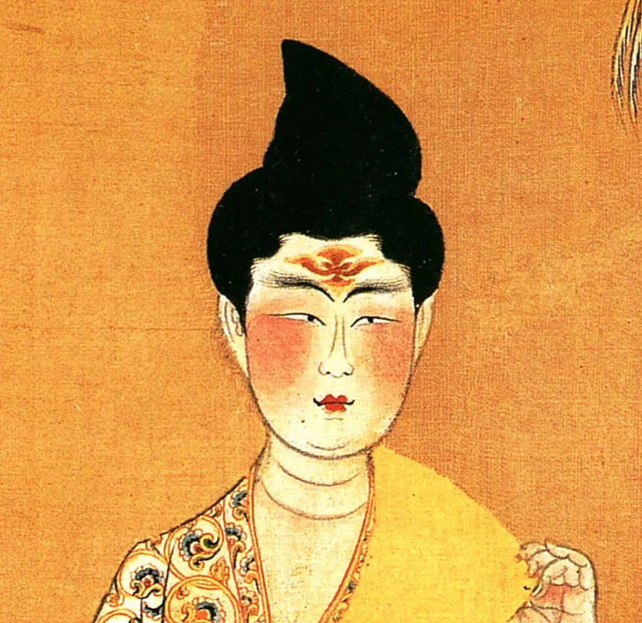 而在嘴角添加了黑点,这就是唐代妆容中的"斜红"和"面靥"